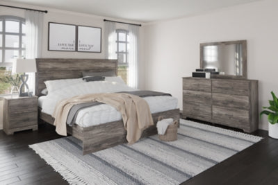 Cama Ralinksi King con paneles, tocador, espejo y mesita de noche