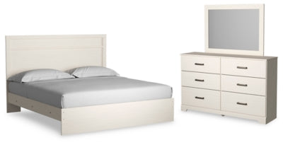 Cama King Stelsie con paneles, cómoda y espejo