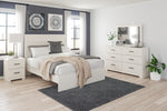 Cama Queen Stelsie con paneles, tocador, espejo y mesita de noche