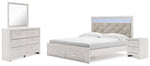 Cama Altyra King con almacenamiento, tocador, espejo y mesita de noche con paneles tapizados