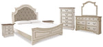Cama tapizada Realyn King con paneles, tocador, espejo, cómoda y dos mesitas de noche