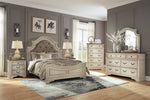 Realyn Queen Upholstered Panel Bed, Dresser, Mirror, Chest and 2 Nightstands