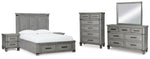 Cama Queen Russelyn con almacenamiento, tocador, espejo, cómoda y dos mesitas de noche