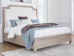 Jorlaina King Upholstered Panel Bed